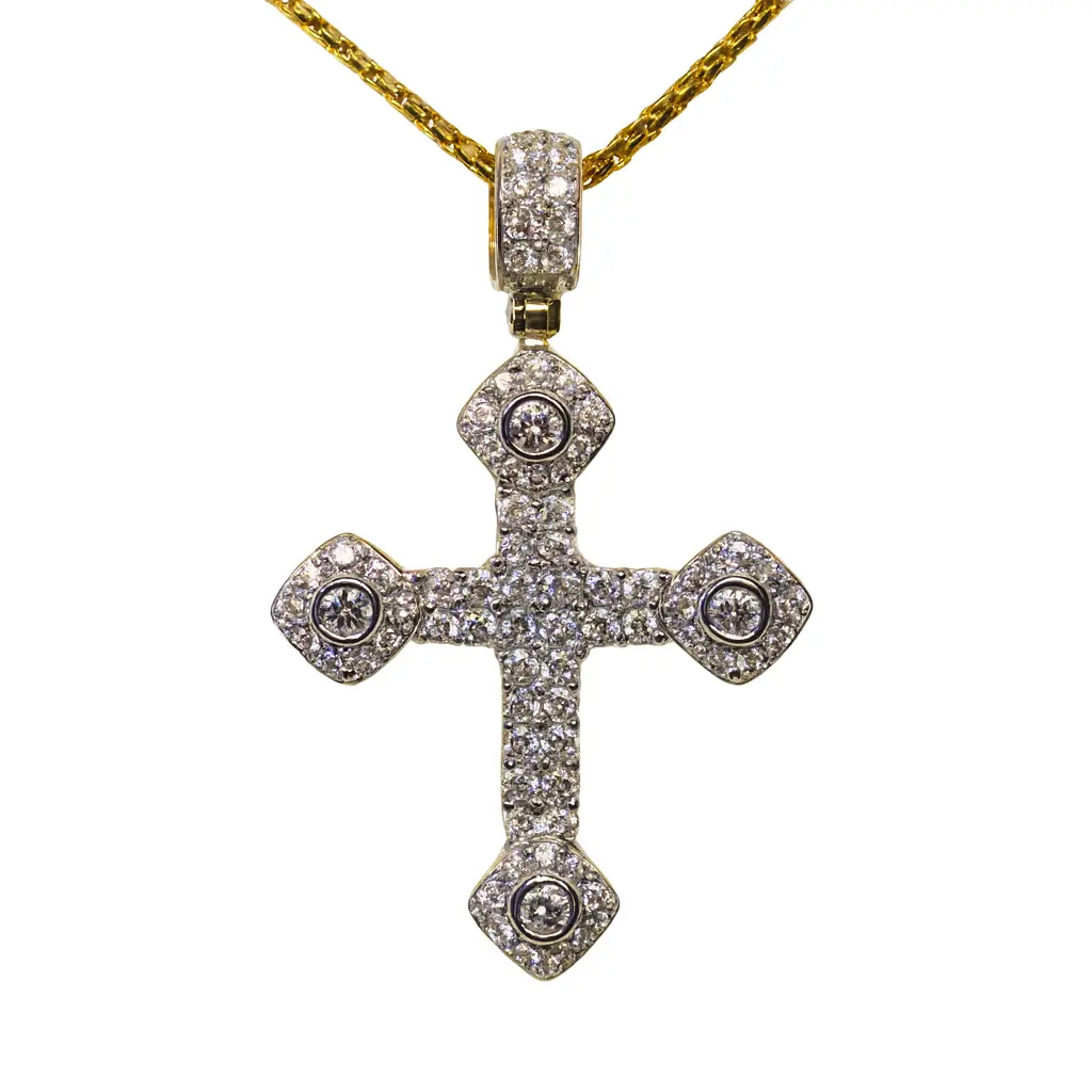 A yellow gold diamond cross pendant